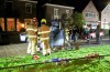 Auto op zijn kant op de Kwelkade